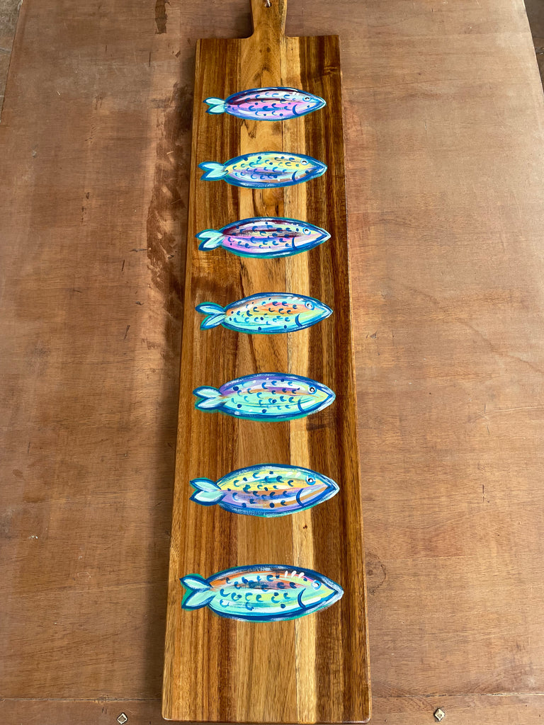 Charcuterie board with painted fish 