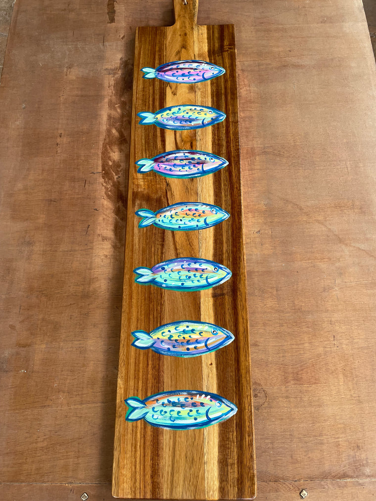 Charcuterie board with painted fish 