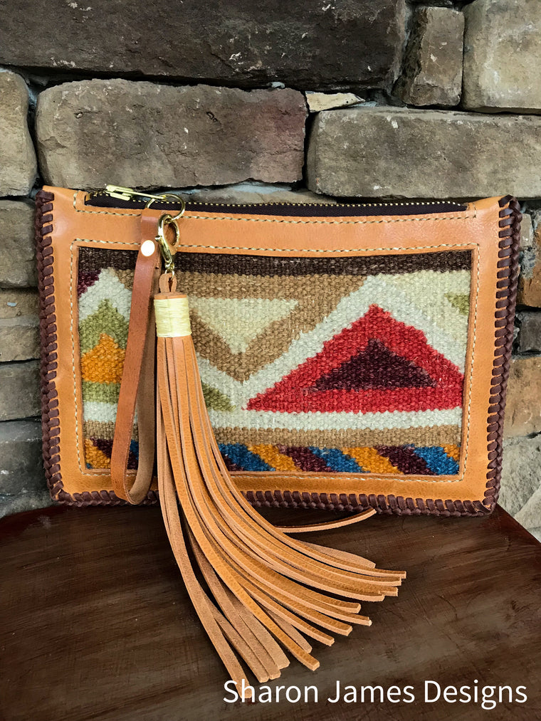 Leather and saddle blanket wristlet clutch 
