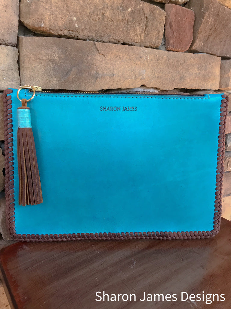 Turquoise leather clutch with double loop lacing